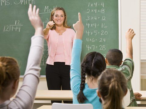 female teacher answering questions at edmonton school