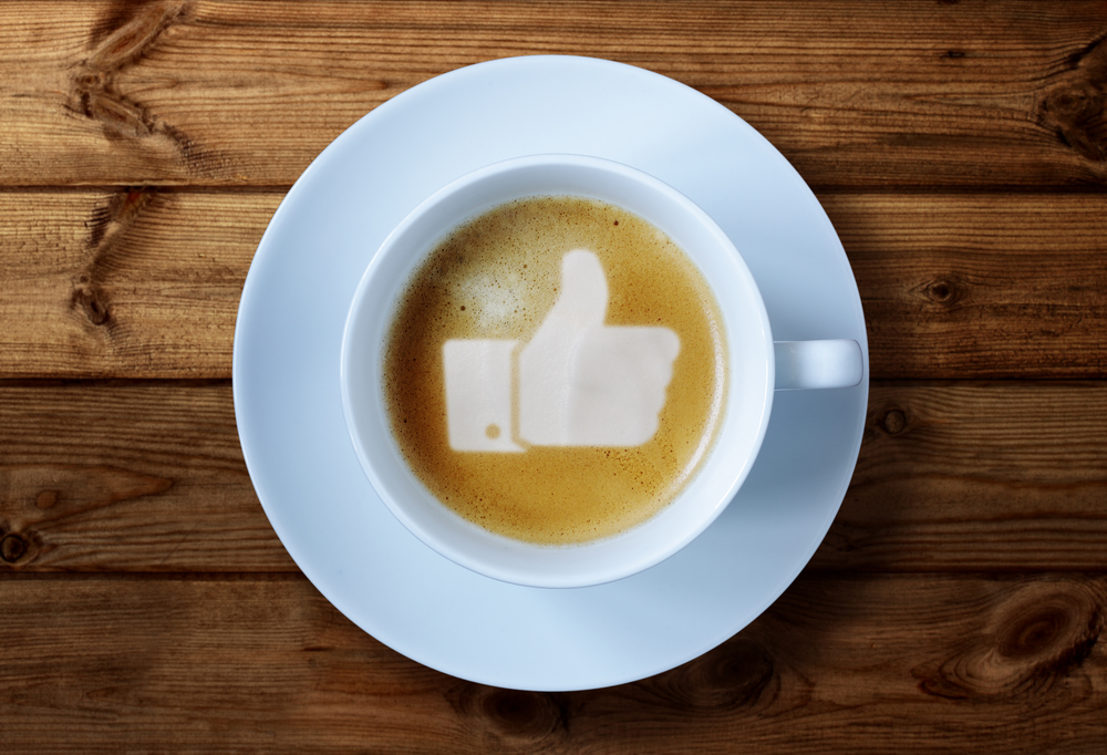 Thumbs up sign in coffee representing Facebook Ads
