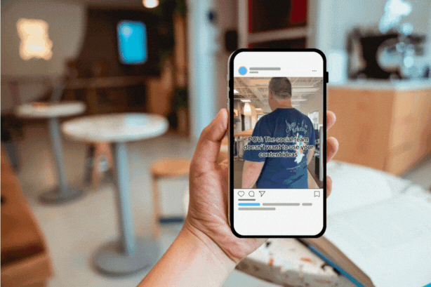 Image of an iPhone user looking at Bluetrain's Instagram post in a cafe.